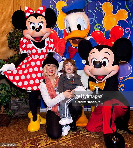 In this handout photo provided by Disney, Christina Aguilera and son Max celebrate his 3rd birthday with Mickey Mouse, Minnie Mouse and Donald Duck...