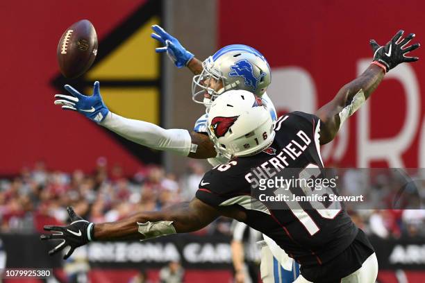 Darius Slay of the Detroit Lions catches the ball intended for Trent Sherfield of the Arizona Cardinals then runs the ball 67 yards for a touchdown...
