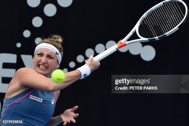 Timea Bacsinszky of Switzerland hits a return against Aliaksandra Sasnovich of Belarus during their women's singles quarter-final match at the Sydney...