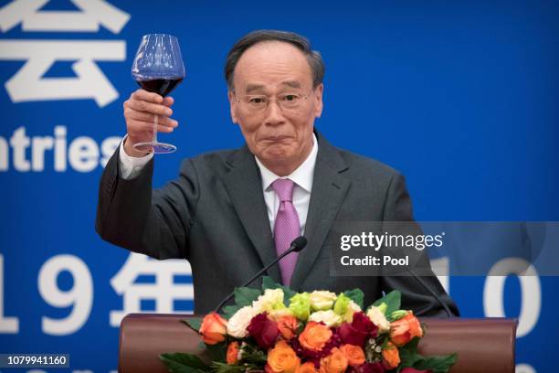 Chinese Vice President Wang Qishan gives a toast during an event commemorating the 40th anniversary of the establishment of diplomatic relations...