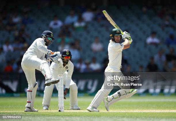 Tim Paine of Australia bats as Rishabh Pant of India keeps wicket during day five of the First Test match in the series between Australia and India...