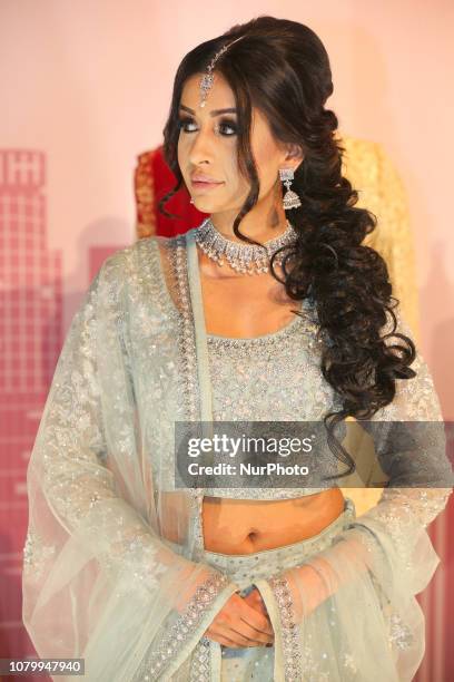 Indian model wearing an exquisite bridal lehenga with traditional opulent jewellery during the Lavish Dulhan bridal show in Toronto, Ontario, Canada....