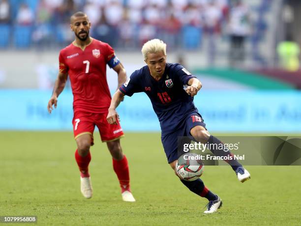 Chanathip Songrasin of Thailand controls the ball against Abdulwhab Ali Alsafi of Bahrain during the AFC Asian Cup Group A match between Bahrain and...