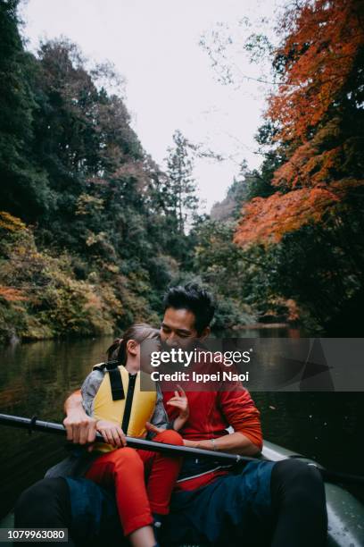 father and daughter having fun time on boat with autumn leaves, japan - off the beaten path stock pictures, royalty-free photos & images