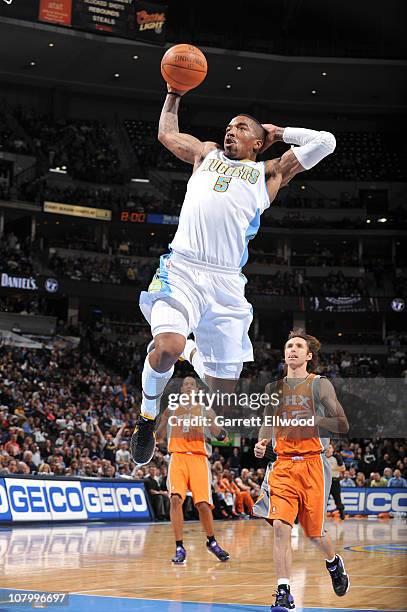 Smith of the Denver Nuggets goes to the basket against Steve Nash of the Phoenix Suns Hornets on January 11, 2011 at the Pepsi Center in Denver,...