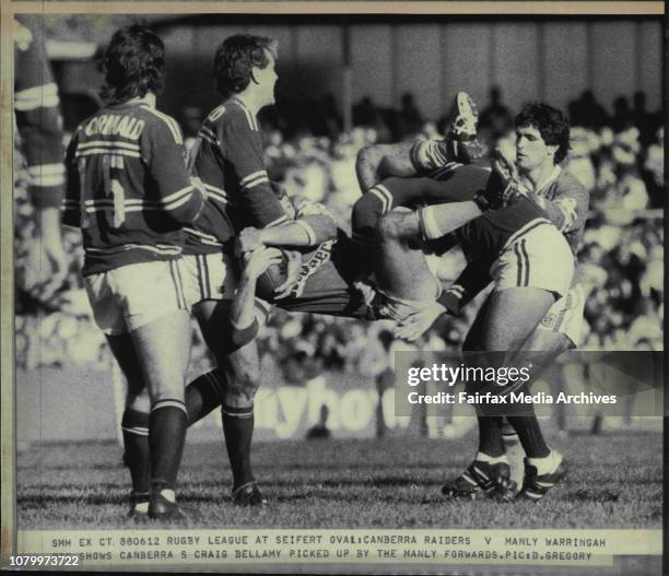 Rugby League at Seifert Oval: Canberra Raiders V Manly Warringah.Canberra's Craig Bellamy picked up by the Manly forwards. June 12, 1988. .