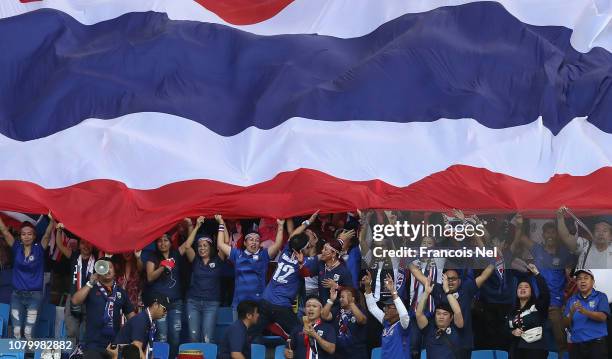 Thailand fans celebrates victory after the AFC Asian Cup Group A match between Bahrain and Thailand at Al Maktoum Stadium on January 10, 2019 in...