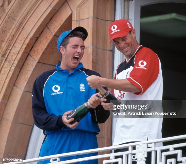 England cricketers Paul Franks and Marcus Trescothick celebrate on the England dressing room balcony after England won the NatWest Series Final...