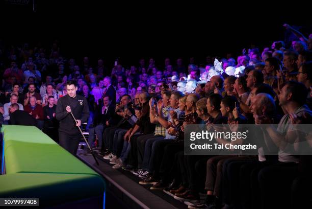 Ronnie O'Sullivan of England chalks the cue during the final match against Mark Allen of Northern Ireland on day 13 of 2018 Betway UK Championship at...