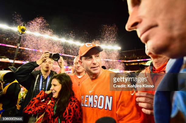 National Championship: Clemson coach Dabo Swinney victorious with wife Kathleen walking off field after winning game vs Alabama at Levi's Stadium....