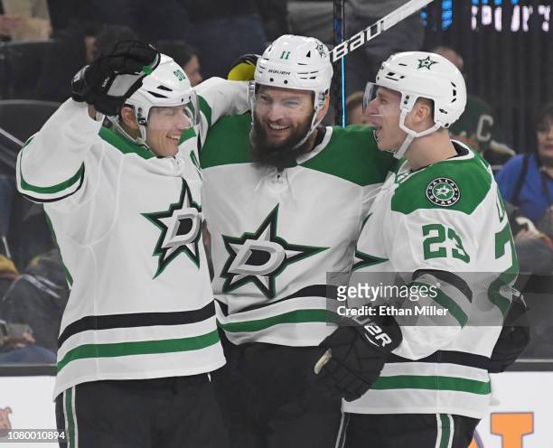 Jason Spezza, Martin Hanzal and Esa Lindell of the Dallas Stars celebrate after Lindell assisted Hanzal on a first-period power-play goal against the...