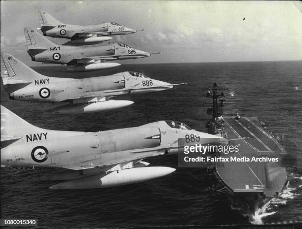 These photographs are the first ever taken of The R.A.N's A-4 Skyhawk attack jet fighters flying in formation over the flagship of the Australian...