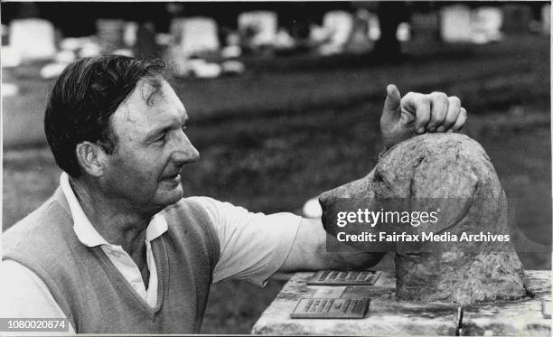 Mr. Edward Jessop-Smith looking at "Bonlab Zulu" and examples of other headstones where owners leave the pets favourite toy and sometimes are buried...