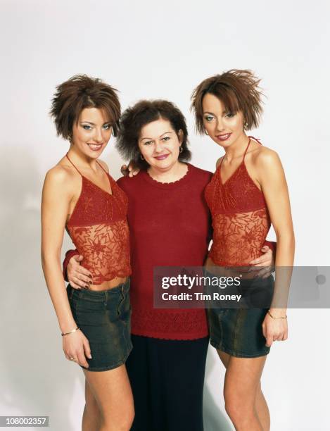 Pop group The Cheeky Girls with their mother Margit Irimia, November 2002. They are Transylvanian twins Gabriela and Monica Irimia