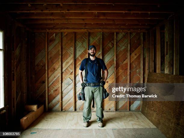 construction worker in home under construction - blue collar portrait stock pictures, royalty-free photos & images