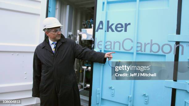 Chris Huhne, Secretary of State for Energy and Climate Change , views a carbon capture and storage test facility at Longannet Power Station on...