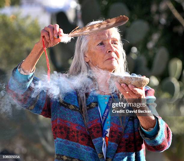 Native American practitioner Carol Locust uses traditional methods to provide healing for the injured at the makeshift memorial for those killed and...