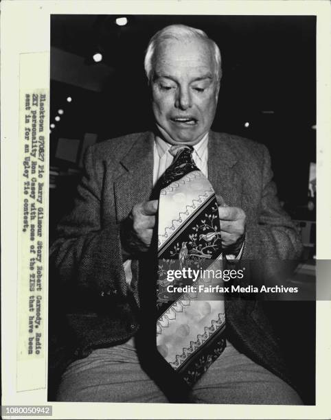 Radio 2KY personality Ron Casey with some of the ties that have been sent in for an Ugley Tie contest. August 27, 1987. .