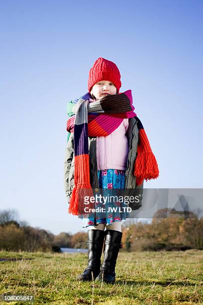 girl in park wearing long knitted scarf, portrait - kid in big shoes stock pictures, royalty-free photos & images