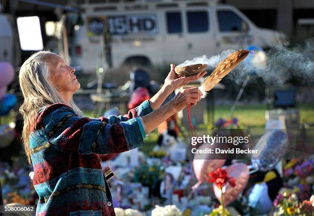 Native American traditional practitioner Carol Locust uses traditional methods to provide healing for the injured at the makeshift memorial for those...