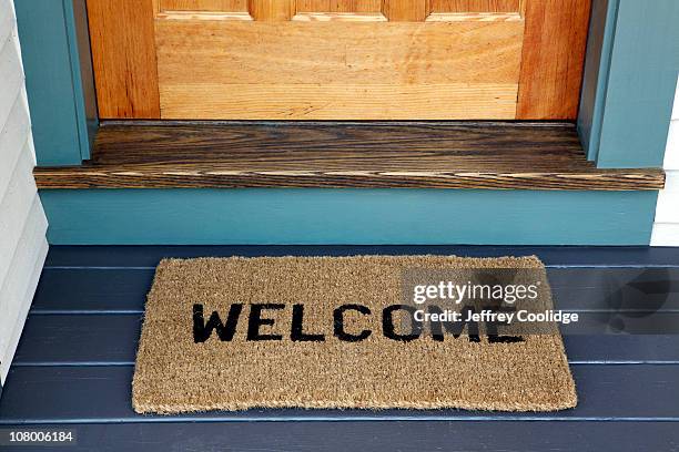 welcome on door mat - doormat stock pictures, royalty-free photos & images