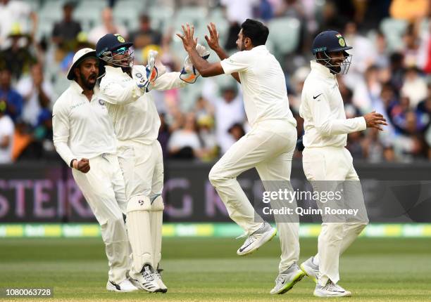 Rishabh Pant and Ravi Ashwin of India celebrate getting the final wicket and winning the test match during day five of the First Test match in the...