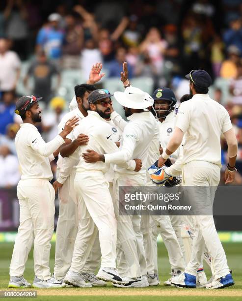 India celebrate getting the final wicket and winning the test match during day five of the First Test match in the series between Australia and India...