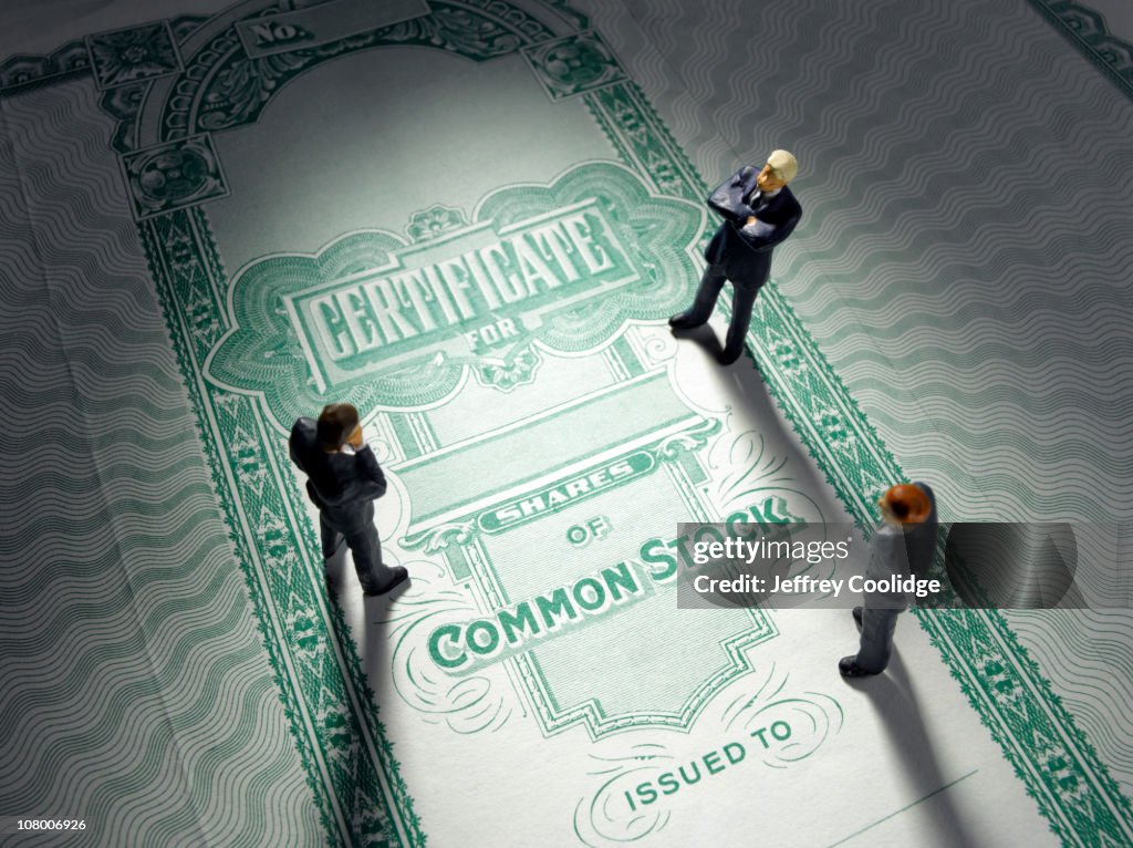 Figurines on Stock Certificate