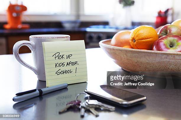 note on kitchen counter - notepad table stock pictures, royalty-free photos & images
