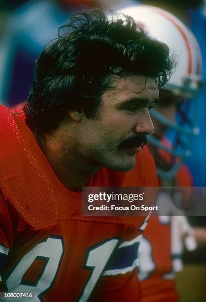 Russ Francis of the New England Patriots watches the action from the bench during an NFL football game at Foxboro Stadium circa 1977 in Foxborough,...