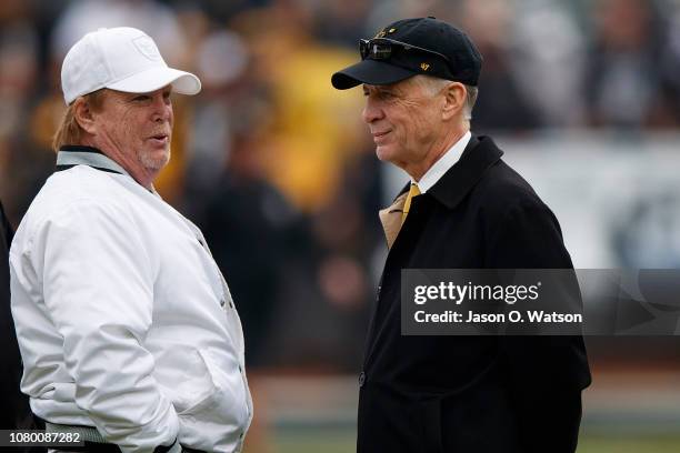 Owner Mark Davis of the Oakland Raiders talks to owner Art Rooney II of the Pittsburgh Steelers before the game at the Oakland Coliseum on December...