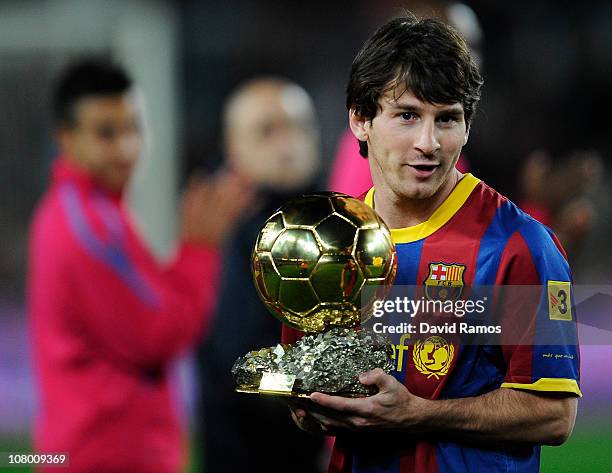 Lionel Messi of FC Barcelona holds the Ballon d'Or trophy prior the Copa del Rey quarter final first leg match FC Barcelona and Betis at Camp Nou on...