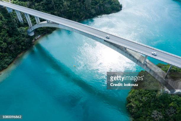 aerial photograph of the beautiful sea and bridge. - bridge stock pictures, royalty-free photos & images