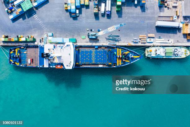 aerial shooting in the logistics area. container ship to anchor. - moored stock pictures, royalty-free photos & images