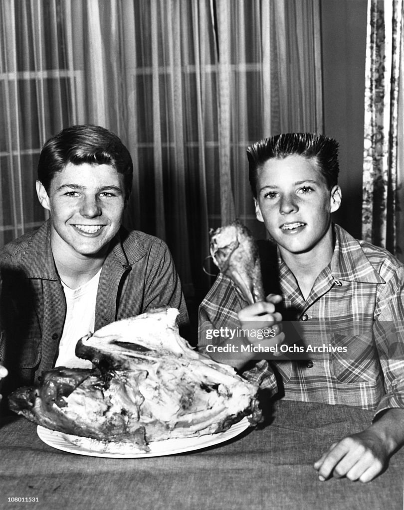 Actors and brothers pose for a publicity shot at home circa 1953 in