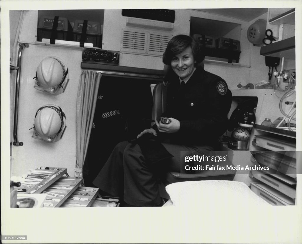 Miss Janet Quinell, NSW's first female paramedic at work tonight checking the gear out in the Summer Hill Intensive care Ambulance. Pictured behind Janet is Mr. Jim Barrett, Janet's training officer.