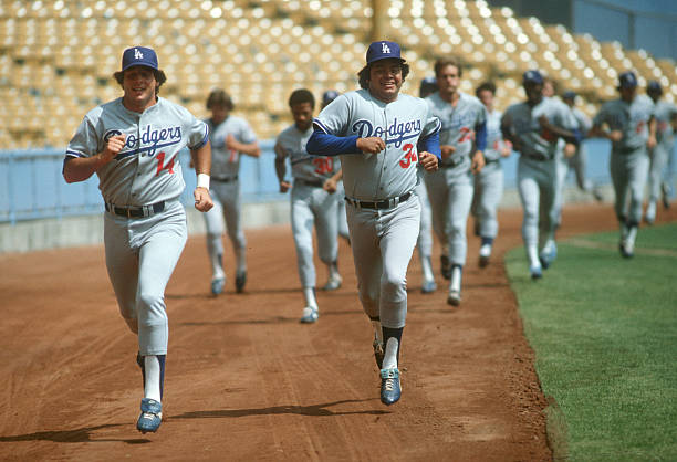 Los Angeles Dodgers Mike Sciosia and Fernando Valenzuela jogging during workout after player's strike at Dodger Stadium.Los Angeles, CA...
