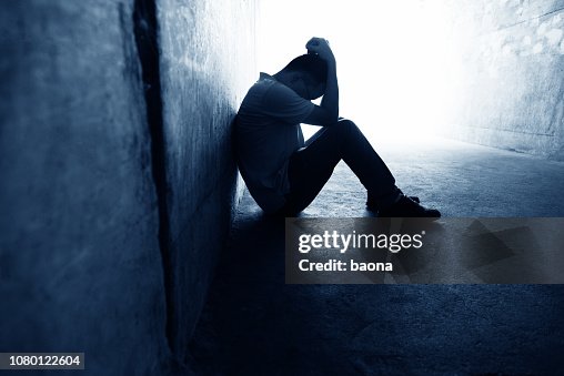 Desperate man sitting in the tunnel Desperate man sitting in the tunnel