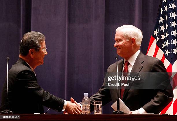 Secretary of Defense Robert Gates shakes hands with Japanese Minister of Defense Toshimi Kitazawa after a joint news conference at the Ministry of...