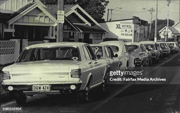 Queue of motorists in Bayview Avenue, Earlwood, waiting to be served with petrol at the XL service station on the corner of Homer Street and Bayview...
