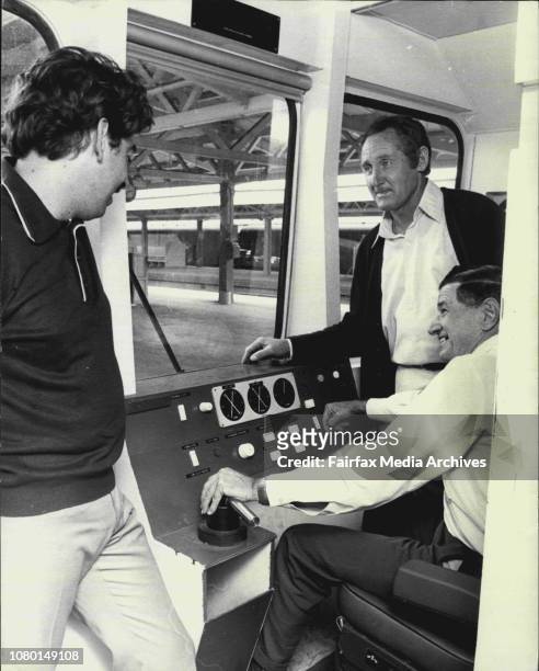 Railway employees Paul Greenwood, electrician of Lakemba, Jim McAloon, driver of Revesby and seated at the controls Laurie Anderson, driver of...