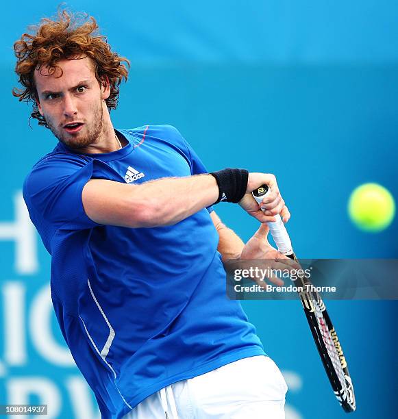 Ernests Gulbis of Latvia plays a forehand in his match against Sergiy Stakhovsky of the Ukraine during day five of the 2011 Medibank International at...