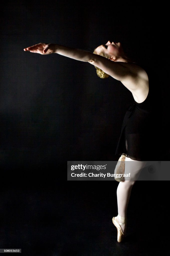 Female Ballerina Dancer balancing on pointed toe