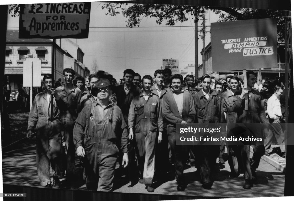 Apprentices from the Eveleigh railway workshops carry banners as they enter the park for the meeting.Transport workers' stoppage - meeting in Prince Alfred Park.