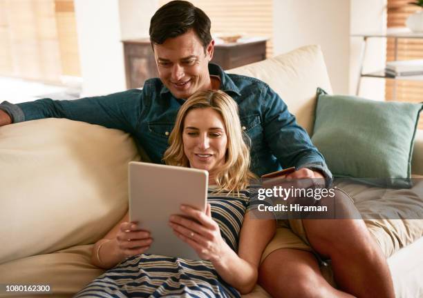 i can't decide which one i want - mid adult couple stock pictures, royalty-free photos & images