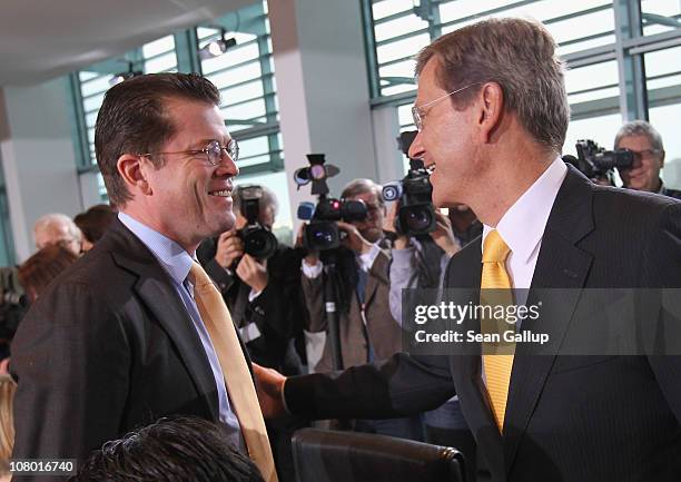 German Defense Minister Karl-Theodor zu Guttenberg and Vice Chancellor and Foreign Minister Guido Westerwelle arrive for the first German government...