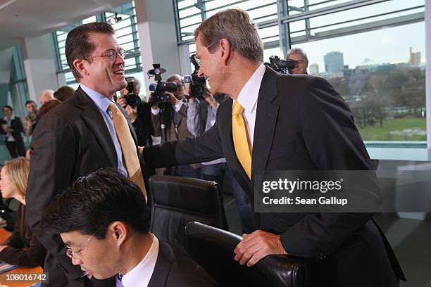 German Defense Minister Karl-Theodor zu Guttenberg and Vice Chancellor and Foreign Minister Guido Westerwelle arrive for the first German government...