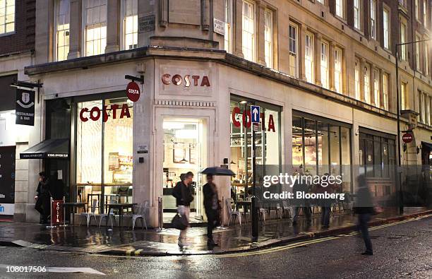 Pedestrians pass a 'Metropolitan' Costa Coffee shop in London, U.K., on Wednesday, Jan. 12, 2011. Whitbread Plc may be considering buying Coffee...