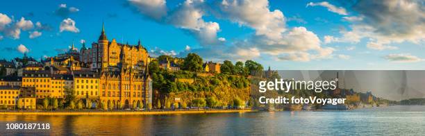 stockholm golden sunset light on sodermalm harbour waterfront panorama sweden - stockholm stock pictures, royalty-free photos & images