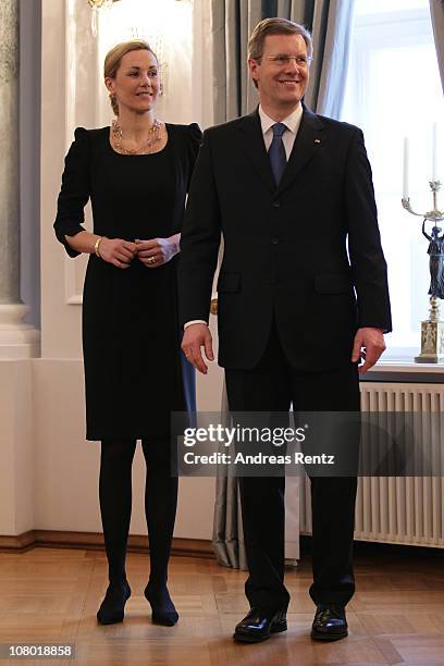 German First Lady Bettina Wulff and German President Christian Wulff gesture during the New Year's reception at Bellevue Palace on January 13, 2011...